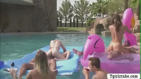 Fresh Busty shemales are in the swimming pool with many guys that,they decide to do orgy and they start kissing each is,they suck their big cocks passionately and they let them bareback their wet ass too my Tube